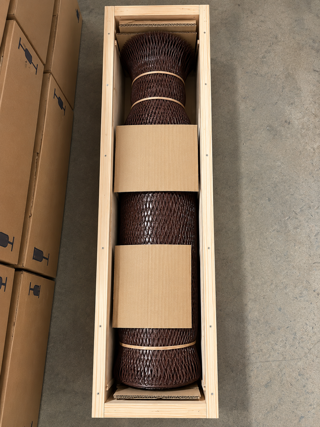 Calibration mixture cylinder protected by mesh and secured in a wooden crate