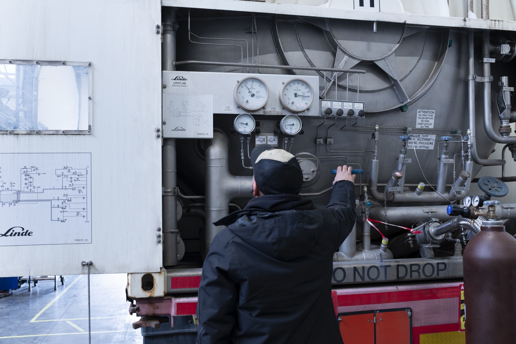 Technician working with a cryogenic transfer system