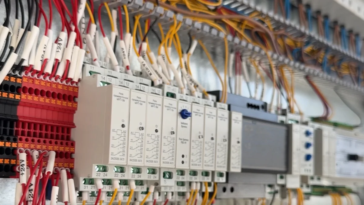 Organized wiring and terminal blocks inside an automation control cabinet