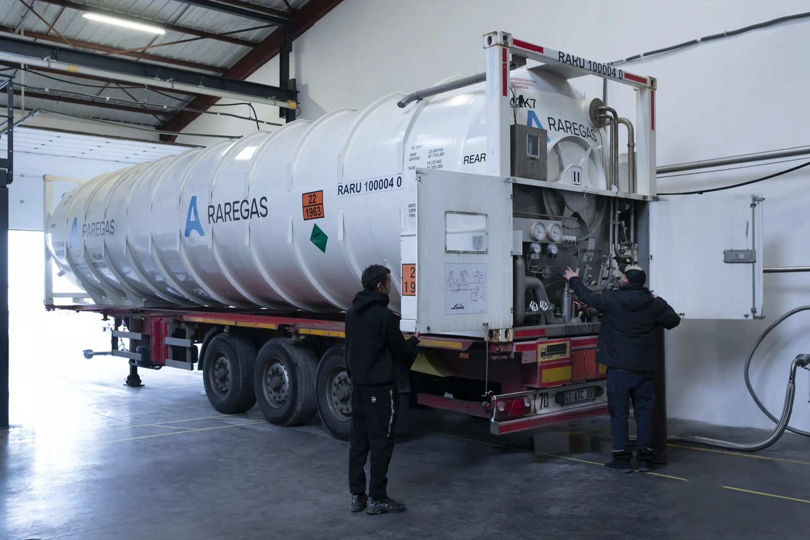 Cryogenic ISO tank container undergoing technical preparation in a workshop