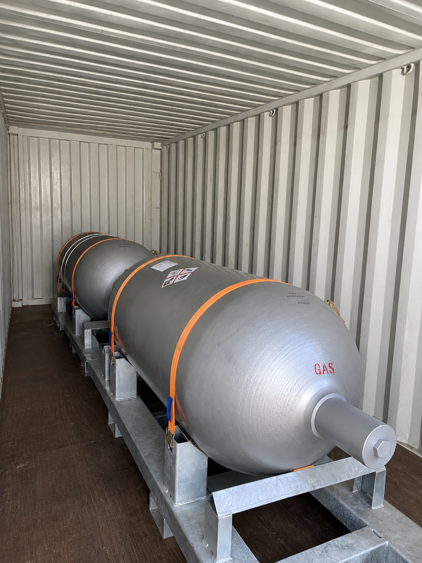 Special-gas containers secured inside a shipping container