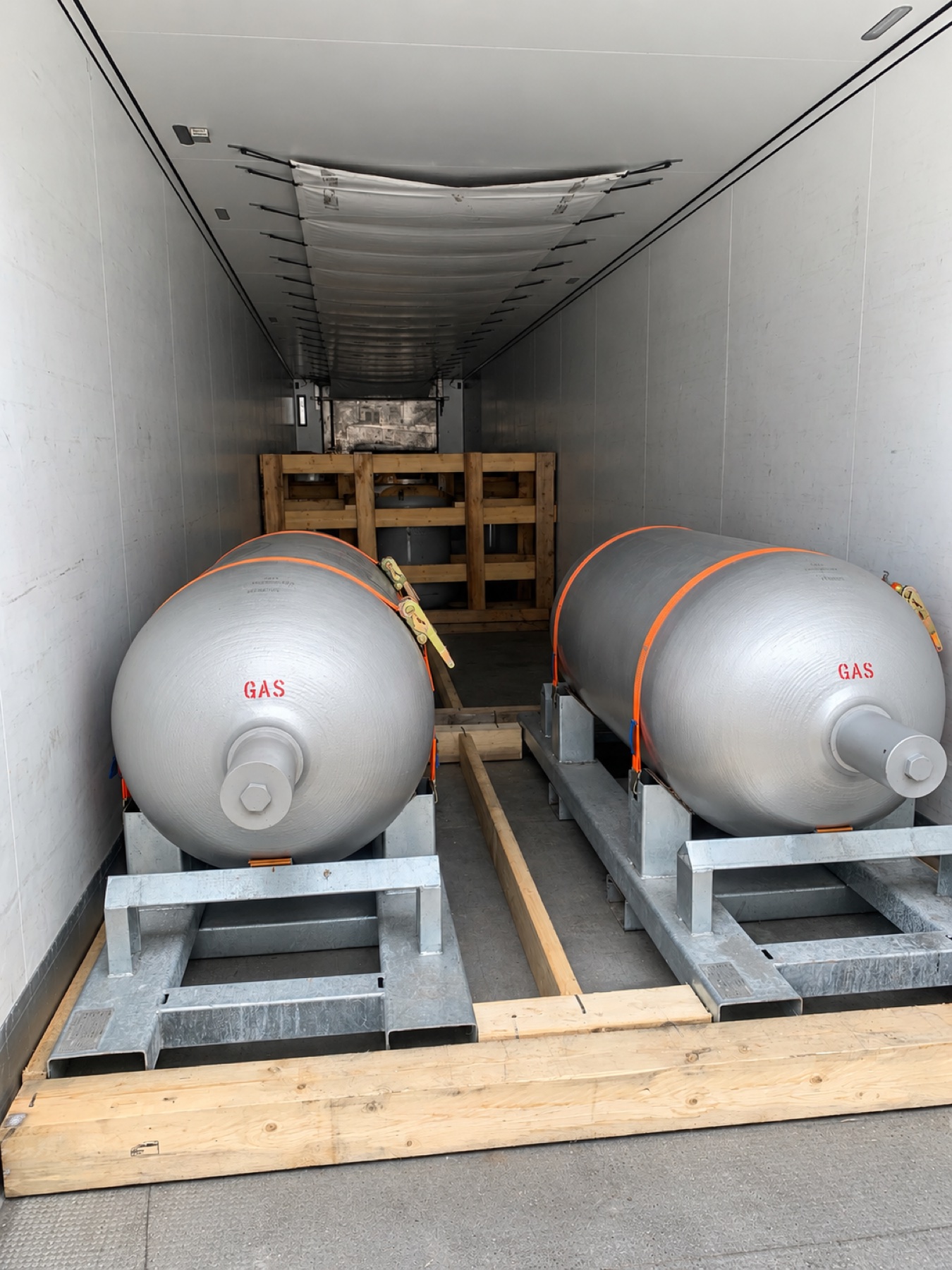 Special-gas containers secured inside a transport vehicle